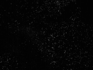 Abstract dirty dust particle grain texture for overlay effect with space for vintage grunge design. White dust on a black background. Noise black background overlay, abstract film noise, black texture