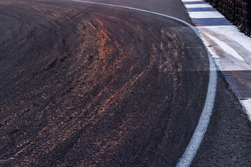 Car tire mark on race track, Abstract black car tire mark on race track, Abstract texture background car tire mark skid mark on asphalt circuit, Tire track on road race speed track circuit.