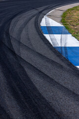 Car tire mark on race track, Abstract black car tire mark on race track, Abstract texture background car tire mark skid mark on asphalt circuit, Tire track on road race speed track circuit.