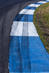 Car tire mark on race track, Abstract black car tire mark on race track, Abstract texture background car tire mark skid mark on asphalt circuit, Tire track on road race speed track circuit.