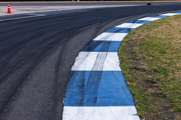 Car tire mark on race track, Abstract black car tire mark on race track, Abstract texture background car tire mark skid mark on asphalt circuit, Tire track on road race speed track circuit.