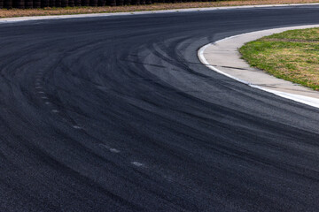 Car tire mark on race track, Abstract black car tire mark on race track, Abstract texture background car tire mark skid mark on asphalt circuit, Tire track on road race speed track circuit.