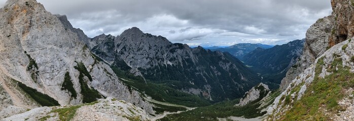 Panoramic view of Logarska dolina valley with peaks of Slovenian Alps covered by passing clouds. © Semi