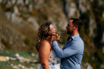 Loving couple sharing intimate gaze outdoors