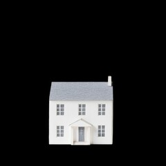Tiny paper house cutout with minimal details, showcasing simple design that evokes sense of creativity and DIY charm. Perfect for craft projects or home decor