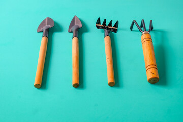 Gardening tools on a color background. Top view,