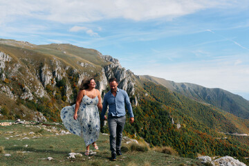 Fototapeta premium Couple walking together on mountain trail