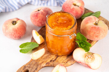 Flat chinese donuts fig peach jam, homemade confiture preserves with fresh fresh fig peaches and mint in white background copy space