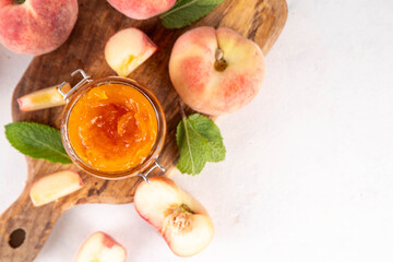 Flat chinese donuts fig peach jam, homemade confiture preserves with fresh fresh fig peaches and mint in white background copy space