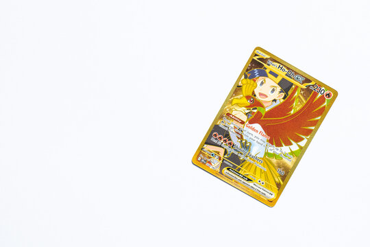 Ethan's Ho-oh EX Pok&eacute;mon trading card shot on a white paper background. It being a hyper rare card from the popular Japanese game franchise. Bradford, UK 06 12 2025