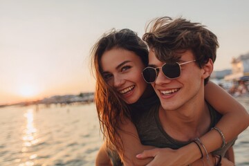 Happy couple enjoying romantic sunset at the beach