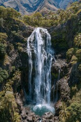 Fototapeta premium The Azores Islands in Portugal boast a waterfall set amidst a lush green landscape