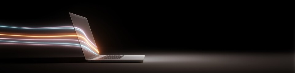 Futuristic laptop with dynamic light streaks on dark background
