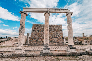 Marble columns supporting lintel over brick wall at archaeological site of Pergamon, Turkiye
