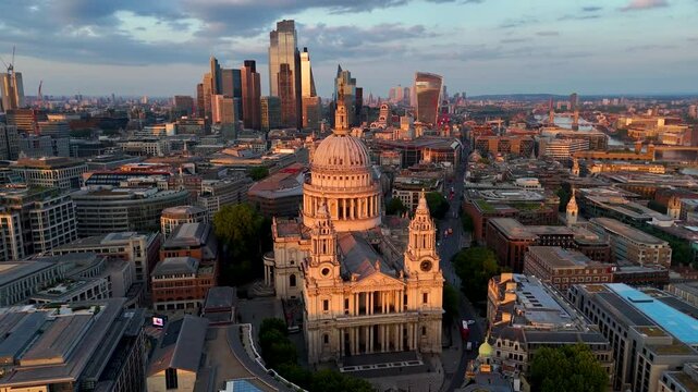 Panoramic aerial view of the London skyline with St. Pauls Cathedral, the city skyscrapers at River Thames during golden sunset time