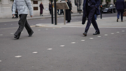 Weekday city life with people walking along urban streets