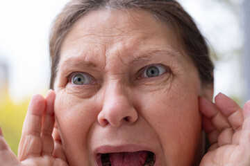 caucasian mature woman holding painful ear close up, hearing loss, Ear Discomfort, Hearing Test, Acute Otitis Media, Treatment and Care