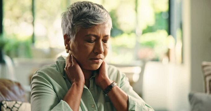 Home, hurt and woman with neck pain, massage or discomfort of injury, sore or bad posture in lounge. Tension, swollen and stiffness of joints, osteoarthritis and muscle strain for old person in house