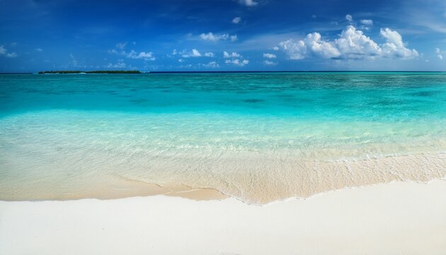 beautiful sandy beach with white sand and rolling calm wave of turquoise ocean on sunny day on background white clouds in blue sky island in maldives colorful perfect panoramic natural landscape