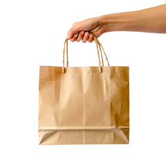 A hand holds a brown paper shopping bag against a solid black backdrop, a classic representation of retail purchases and takeaway services.