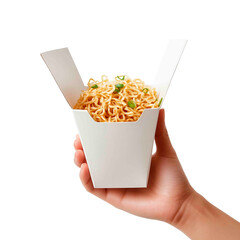 Close-up shot capturing a person's hand holding a carton filled with cooked noodles, garnished with green onions against a dark background.