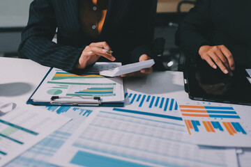 Two business people analyzing the data