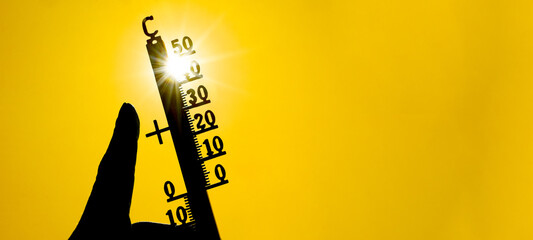 Hot weather, global climate change concept - Heat wave / Summer heat temperature celsius background banner long - Thermometer yellow orange sky and sun rays