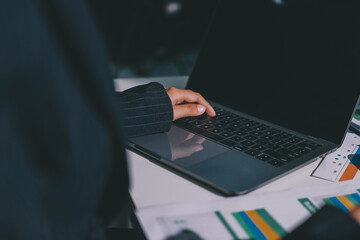 Group of business women working on a financial data expenses document.