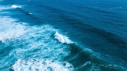 Aerial View of Turquoise Ocean Waves with White Froth