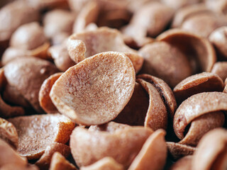 Chocolate cereals corn flakes close-up of Cornflakes pile for breakfast, heap of brown choco...
