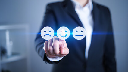 Businessperson selecting happy face customer feedback survey
