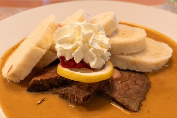 Traditional Czech Dish Svíčková with Dumplings, Cranberries, and Cream, Prague, Czech Republic