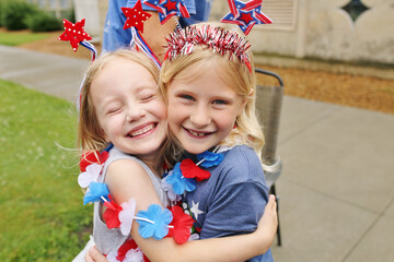 Happy Kids Hugging as they Celebrate 4th of July in the USA