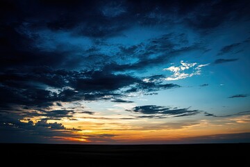 Dramatic sunset sky with dark clouds
