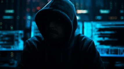 Hacker at Work in Dark Room with Screens
- Powered by Adobe