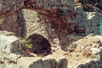 ancient ruins of Cleopathra Bath in Hamam Bay, Turkey, historical site in mediterranean coast submerged partly in water
