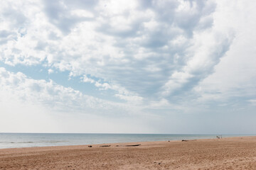 The clouds over Lake Michigan and Kohler-Andrae State Park, Sheboygan, Wisconsin, angle southward to the distant horizon