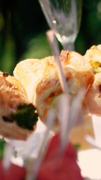 Sweet croissants with filling and strawberries at a festive dessert buffet. Banquet table at the event and holiday. Confectionery sweets close-up