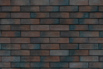 Textured brick wall in shades of brown and gray for architectural designs