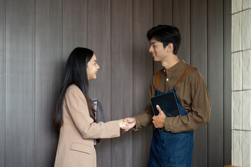 Entrepreneurial Partnership. Young professionals shaking hands after a successful meeting.
