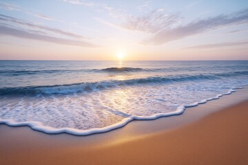 Peaceful beach scene at sunrise with soft waves, golden sand, and warm light reflecting on water creating a calming seaside travel background.