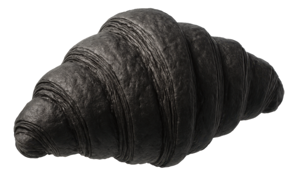 Charcoal-infused croissant showcasing a deep black color with a flaky and layered texture.