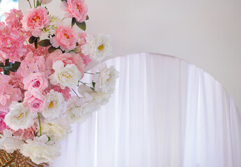 White and pink flowers decorate a white background.