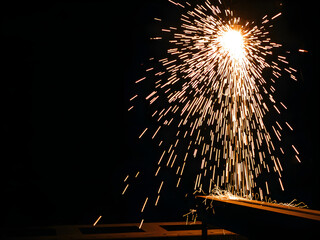 Metal workshop with glowing sparks in motion, showcasing raw industrial energy and precision craftsmanship.