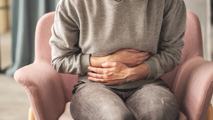 Young woman with stomach ache