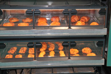 Fresh Pastries Baking in a Glass Fronted Oven.