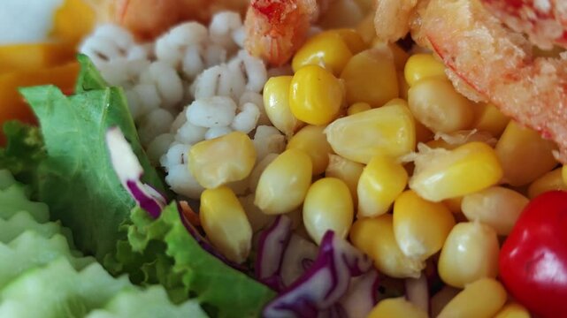 Fried shrimps tempura and fresh salad