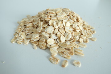 A pile of rolled oats with a white background, Ingredients for preparing a meal, Carbohydrate