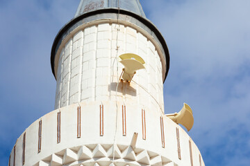 Minaret with attached loudspeakers used for call to prayer. Traditional Islamic religious building element