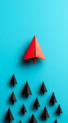 Fototapeta premium A red paper airplane leads a group of smaller black paper airplanes on a bright blue background, symbolizing leadership and standing out from the crowd.
